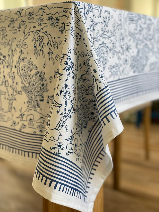 Tablecloth with blue and white pattern on a wooden table